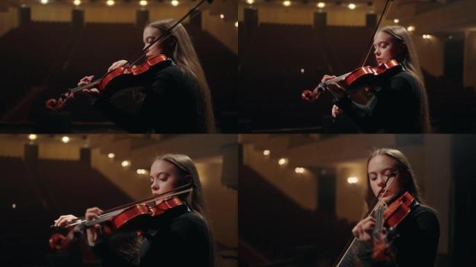 漂亮的女小提琴手在交响乐团演奏小提琴，女音乐家的肖像