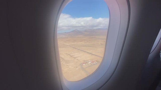 第一人称视角从下面加那利群岛的飞机窗口向外看