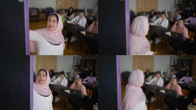 Teacher talking to students in classroom at univer