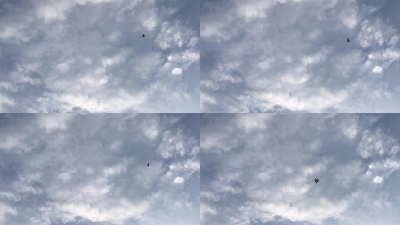 风筝漂浮在空中，装饰着蓝天白云