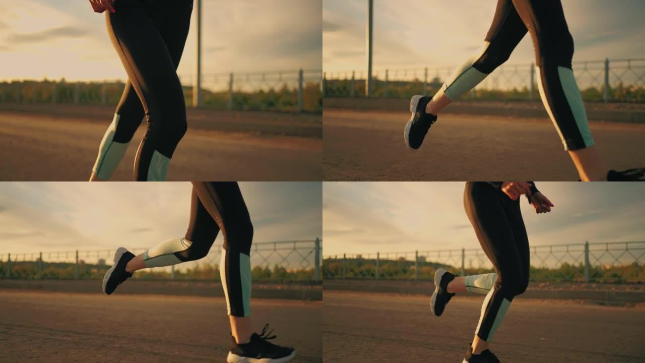运动女子在日落或傍晚在外面奔跑，穿着运动服的身体特写