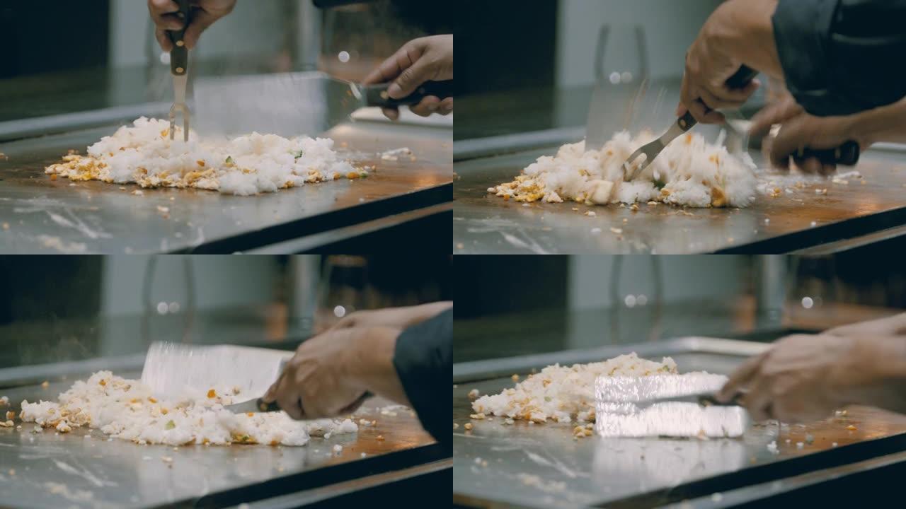 一名男子在厨房的平烤架上做饭的细节照片