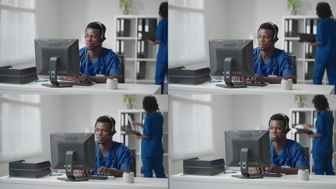 在医院工作的带耳机和计算机的美国黑人男性医生或护士。年轻的专业治疗师医生使用网络摄像头上的远程通信咨