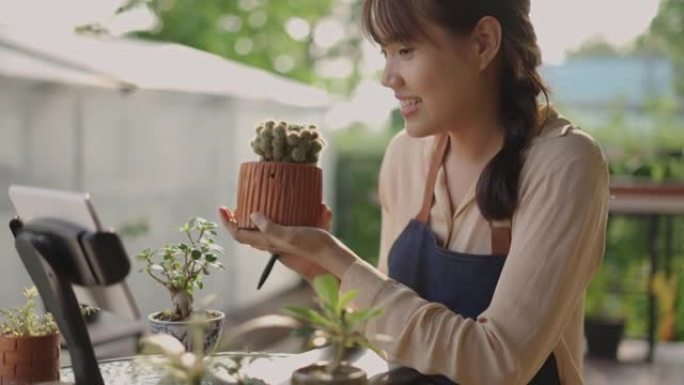 年轻的亚洲女子有直播卖仙人掌