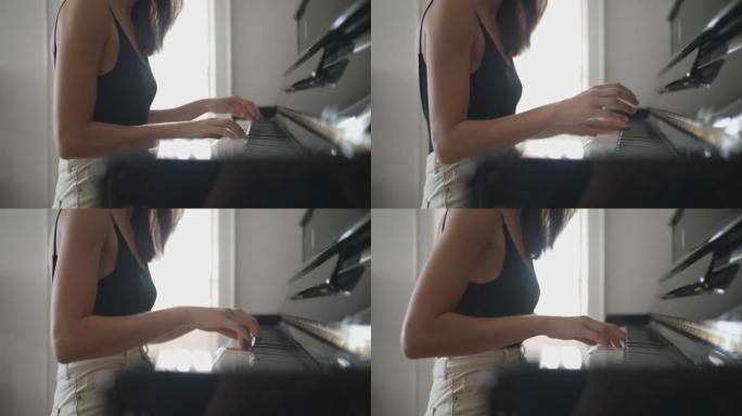 弹琴的年轻女子弹钢琴钢琴练习