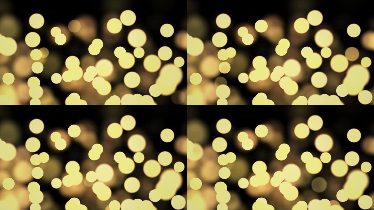 4k循环抽象运动背景闪亮黄金颗粒。散景闪烁着闪闪发光的粒子。