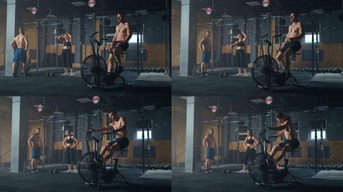 在专业运动员的现代健身俱乐部内，男子在固定自行车上锻炼