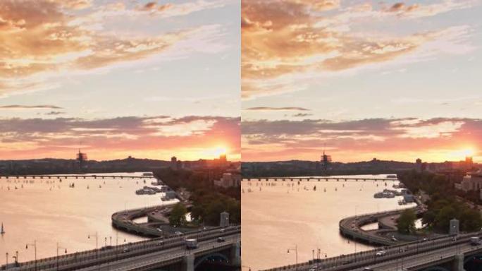 太阳与地平线相遇时，火车穿越朗费罗大桥的垂直航拍