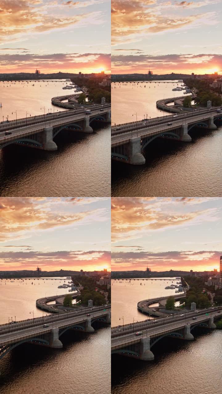 太阳与地平线相遇时，火车穿越朗费罗大桥的垂直航拍