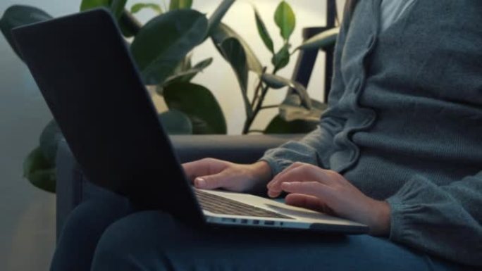 Close up of female hands busy working on laptop or