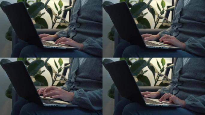 Close up of female hands busy working on laptop or