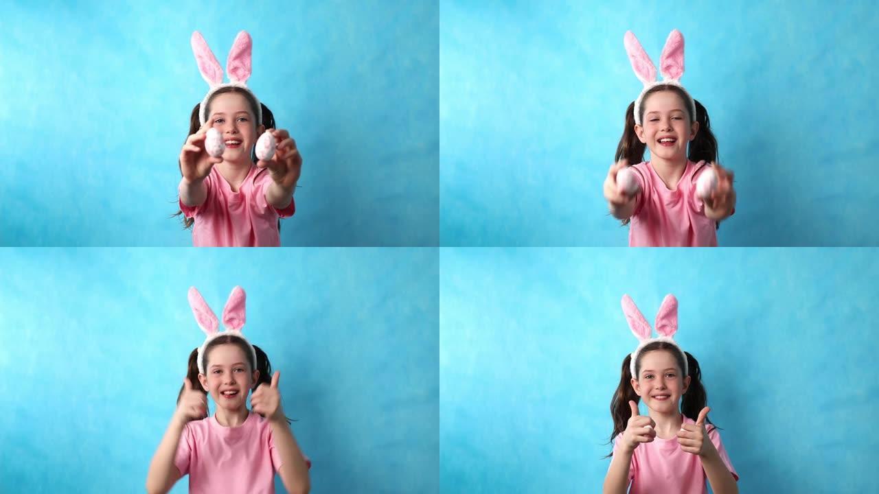 一个穿着复活节兔子服装的可爱的小女孩手里拿着复活节彩蛋。
