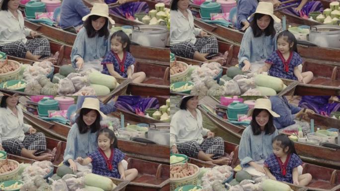 妈妈和女孩在浮动市场旅行