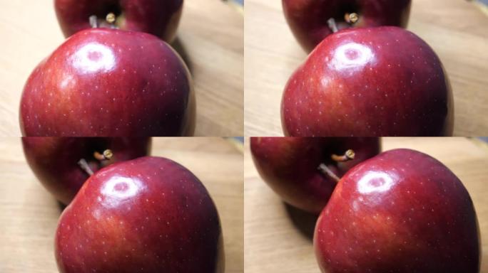 红苹果果皮上的亮点。大成熟苹果特写，旋转。