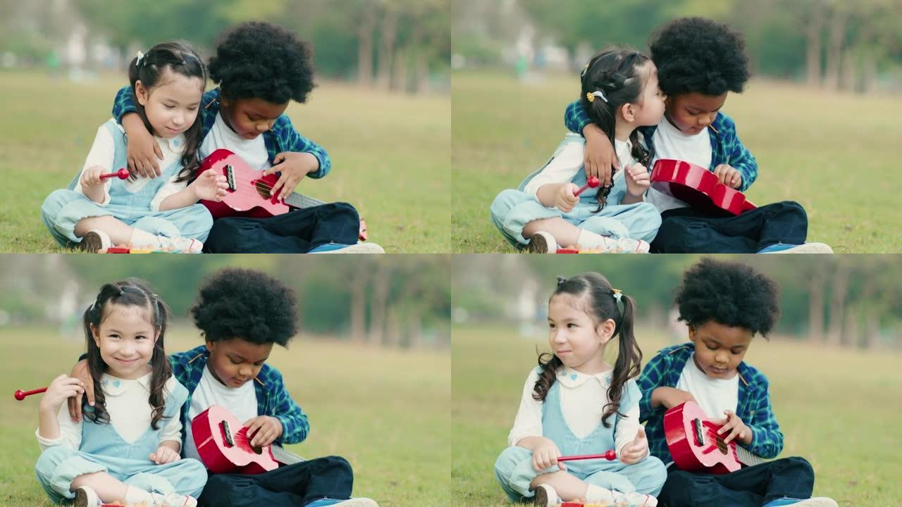 两个孩子在户外公园玩吉他玩具