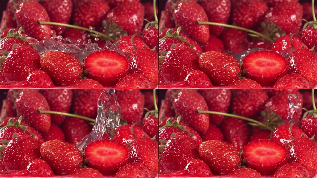 草莓落在草莓之间的水中。慢动作1000 fps