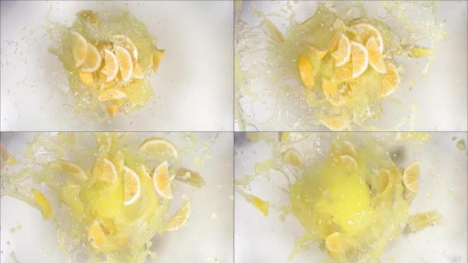 爆炸柠檬和爆裂果汁和切片的超慢动作