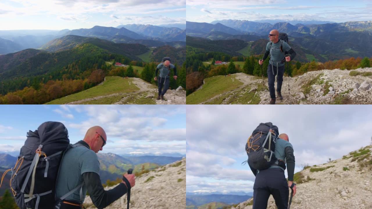 SLO MO男性徒步旅行者走在陡峭的小径上，欣赏美景