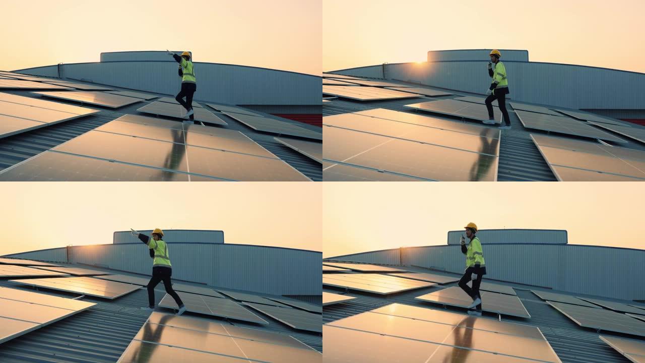 维修工程师技术人员在工厂工作时从太阳能屋顶发电