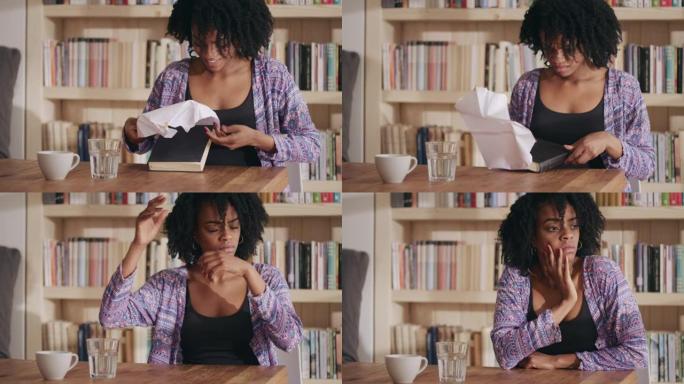 非洲族裔妇女用等待的书打开包裹。愤怒地撕纸