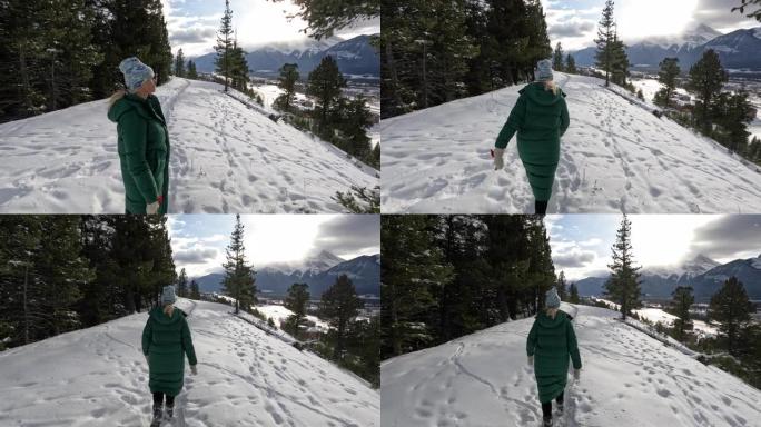 女人在冬季风景中穿越雪中时的第一视角