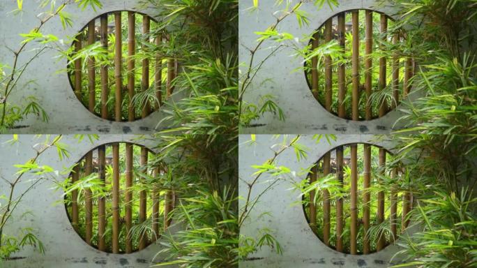 宁静的中国花园中的竹制室内窗户