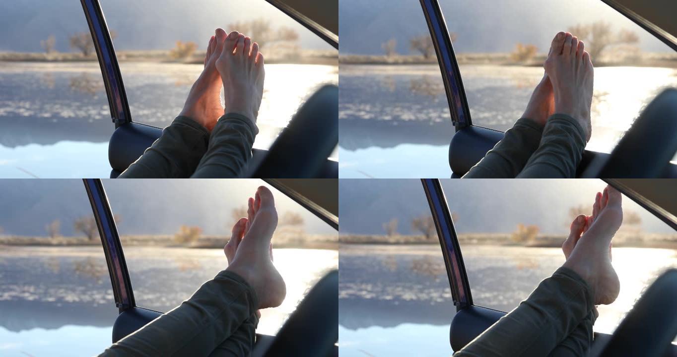 女人在汽车驾驶员座椅上放松，腿的细节视图