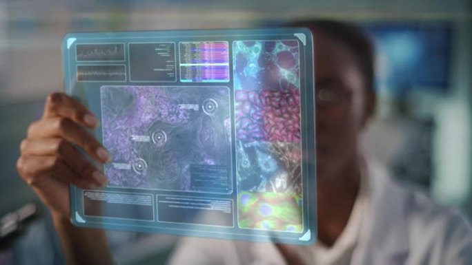 研究血液中病毒细胞的非洲民族女科学家。手持未来的触摸屏
