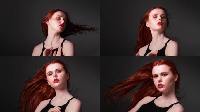 美丽的红发女人，留着健康的长发。翻转头发，用相机调情