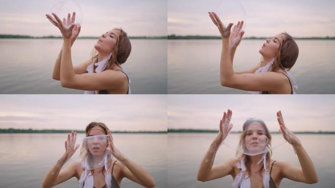 一位年轻的女孩艺术家使用肥皂泡展示魔术。在您的手中创建肥皂泡，并在日落时将其充气。