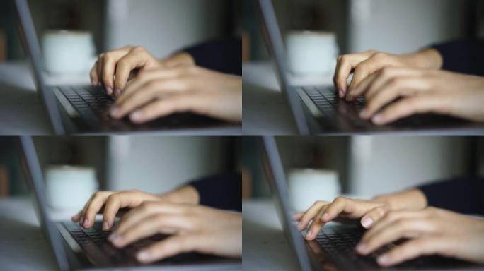 女人的手在笔记本电脑上打字的细节照片