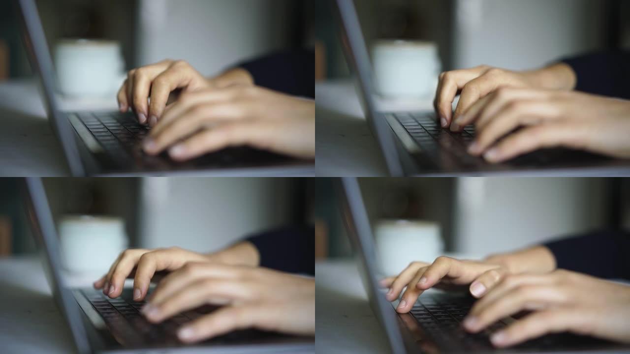 女人的手在笔记本电脑上打字的细节照片