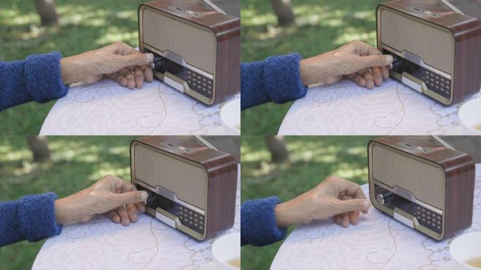 后院老式收音机上的高级女性手旋钮。