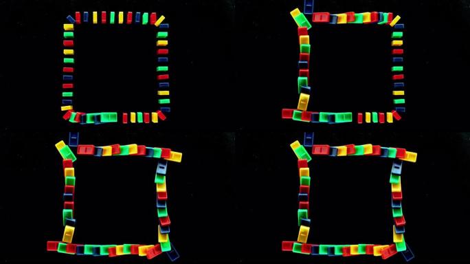呈正方形的SLO MO LD彩色多米诺瓷砖落在黑色表面上