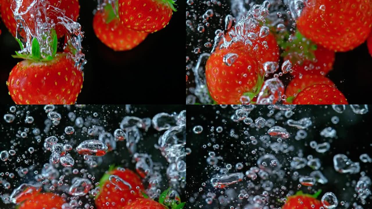 SLO MO LD草莓在黑色背景下落入水中