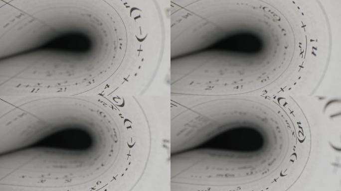 微距视图书籍文本幻灯片多莉用劳瓦探针镜头拍摄。相机在纸质书页之间移动。数学公式、图纸和图表。极端特写