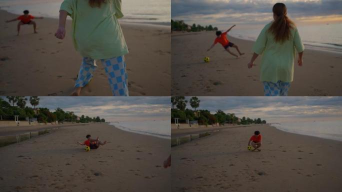 慢动作: 夫妇在海滩日落时踢球
