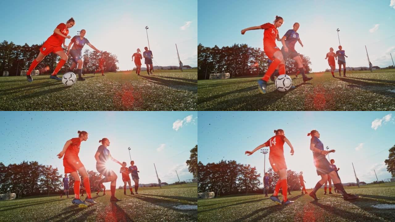 SLO MO两名女子足球运动员为球而奔跑，红队球员踢了球