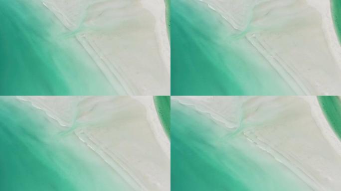 空中无人机拍摄了带有绿色水域的沙滩