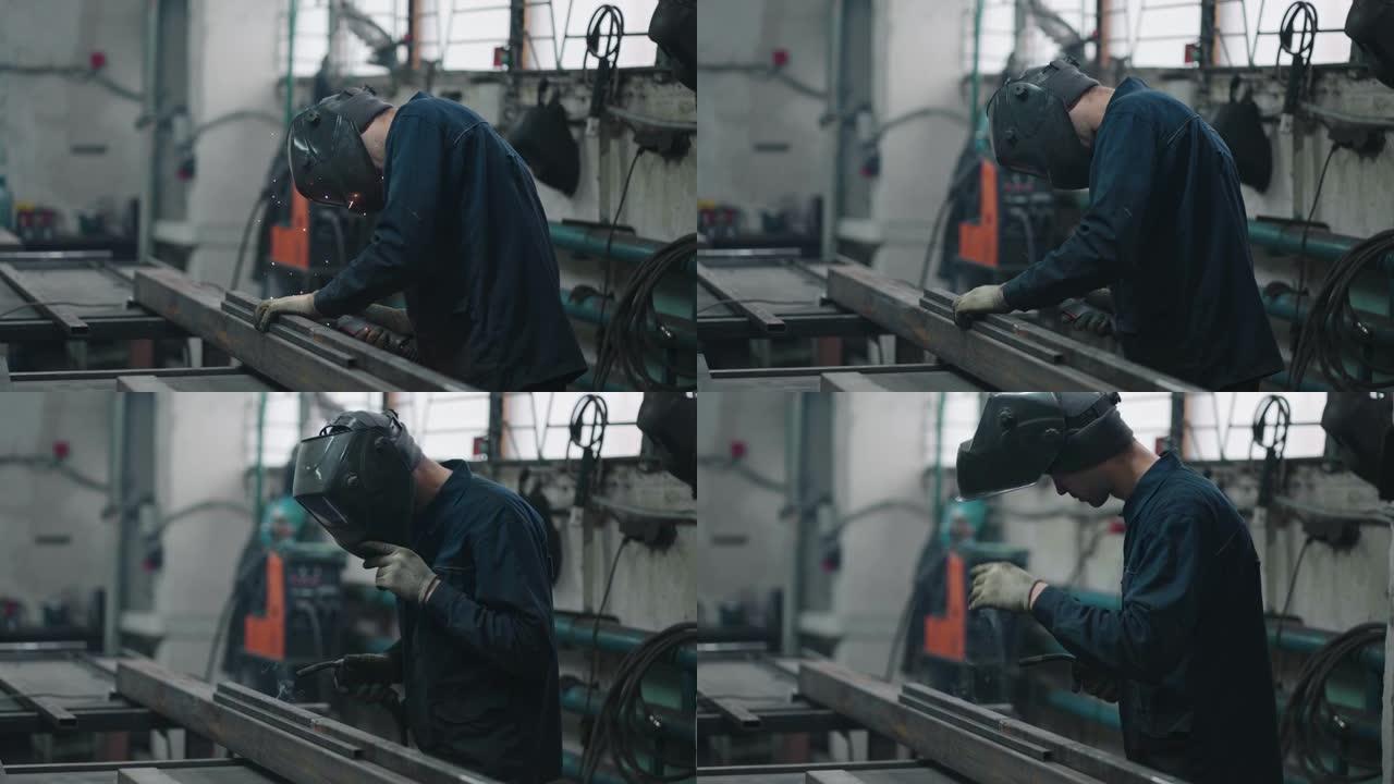 工作焊机以慢动作通过气体或电焊连接金属零件。钢铁生产工作