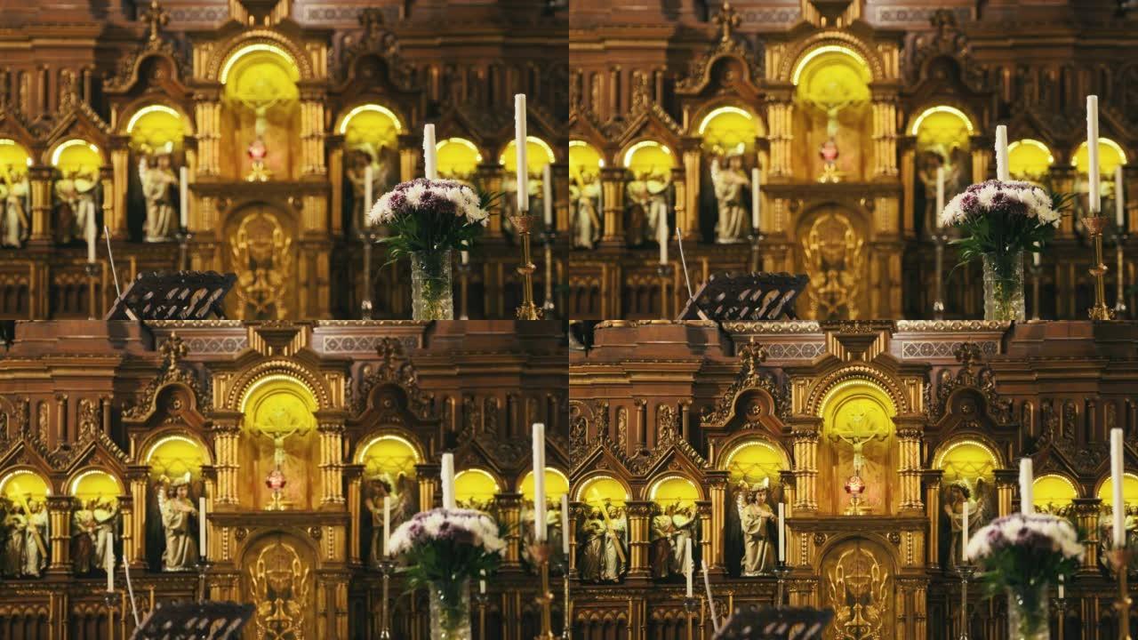 教堂祭坛上有蜡烛和圣徒雕像