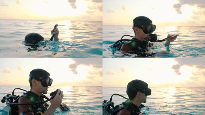 日落时从水中浮出水面的潜水员的特写镜头