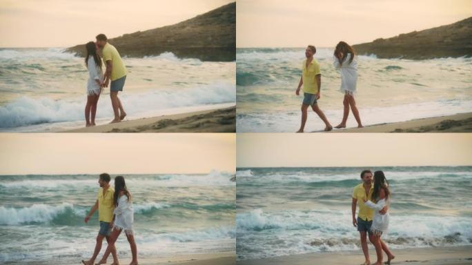恋爱中的异性恋浪漫情侣。阳光明媚的日子牵着手在海滩上浪漫散步