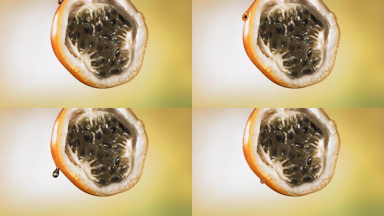 慢动作宏观拍摄来自减半的格拉纳迪拉汁的流动格拉纳迪拉汁