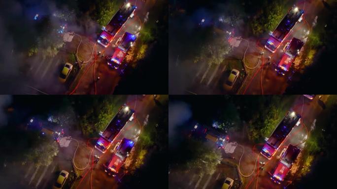 一群消防员夜间灭火的无人机飞行视点。英雄救人