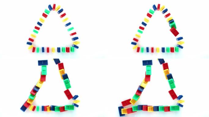 SLO MO LD彩色多米诺骨牌成三角形，落在白色表面上