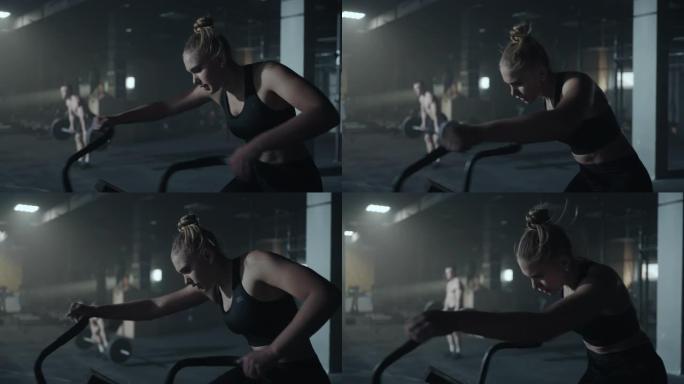 健身房里的人，女人在健身馆里努力训练自行车，疲惫的运动员肖像