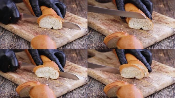 烹饪时在砧板上切一个小麦长棍面包