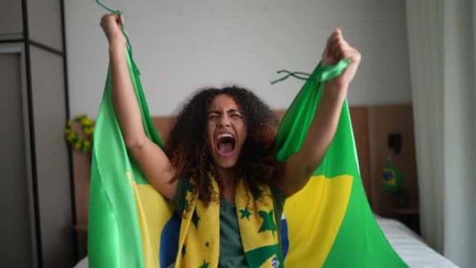 庆祝巴西足球队在主场进球的年轻女子