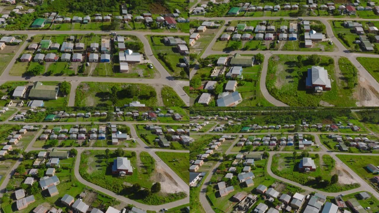 贫困村庄简易房屋的高角度视图。向后飞越住宅开发。南非